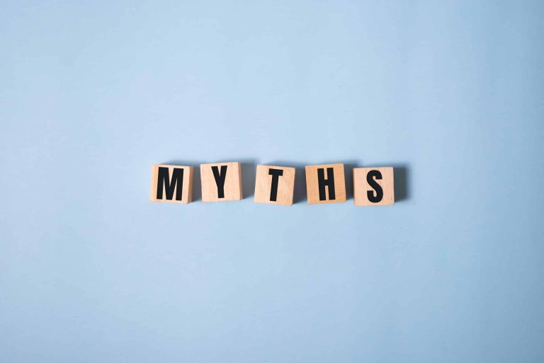 Myths word on wooden cubes. Myths concept on blue